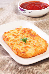 Hash browns on white plate 