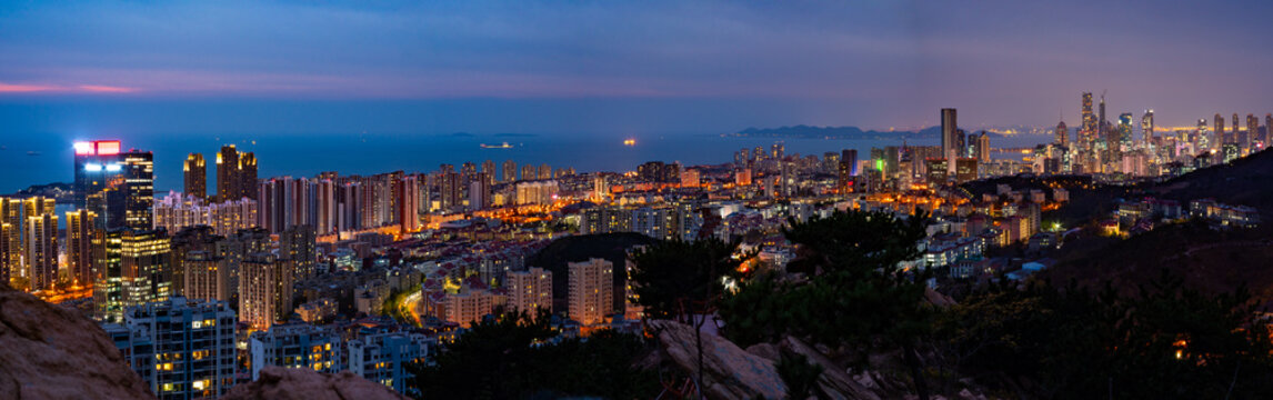 Aerial view of a sunset sky over the coastal city of Qingdao, Shandong Province, China,Panorama