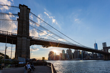 Sunset of the Brooklyn Bridge and New York City skyline