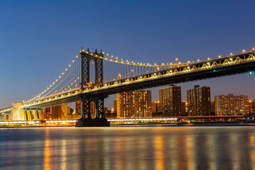 Night view of the Manhattan Bridge and New York City skyline
