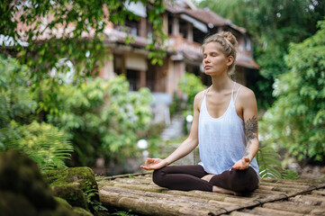 Girl practice yoga meditation outdoor in park