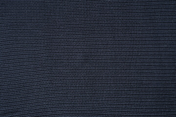 Black fabric texture. Dark gray knitted background
