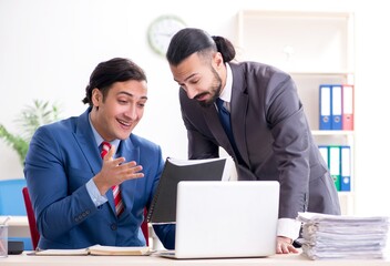 Two male colleagues in the office