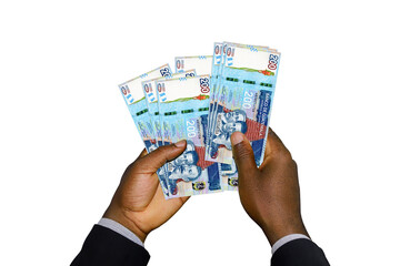 Black Hands in suit holding 3D rendered Guatemalan quetzal notes