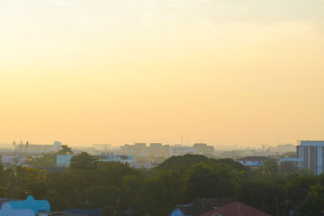 Aerial view city office building with sunset sky cloud