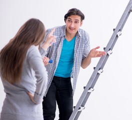 Young family doing renovation at home