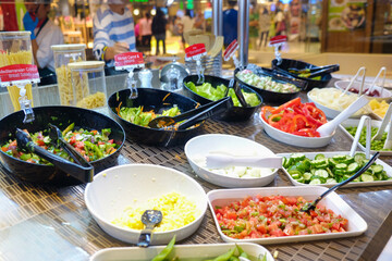 Colorful vegetable with sauce on plate in dinner salad bar healthy food