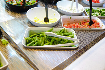 Colorful vegetable with sauce on plate in dinner salad bar healthy food