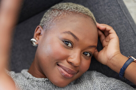 Smile, Black Woman On Sofa And Phone Selfie, Taking A Profile Picture For Social Media Or Online Dating App. Relax, Happy And Woman Laying On Living Room Couch Taking Photo For Self Love From Above.