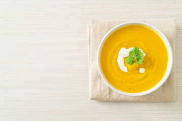 pumpkin soup in white bowl