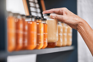 Hands, jar and honey shelf for inventory check, product pricing or labeling in organic retail...