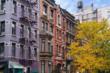 New York street with row of colorful old apartment buildings