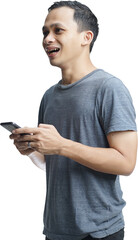 Young smiling handsome Asian man in casual attire using mobile phone isolated studio background