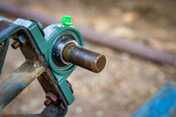 Pulley belt of a small old tractor.