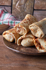 several wheat pancakes stuffed with stuffing lie on the kitchen table