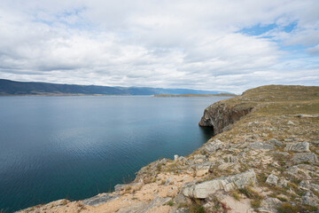 Beautiful summer landscape of Baikal Lake on sunny day. View of the rocky cape