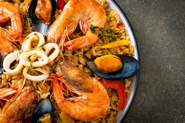 Seafood Paella with prawns, clams, mussels on saffron rice