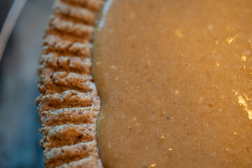Pumpkin pie close-up with crust.  