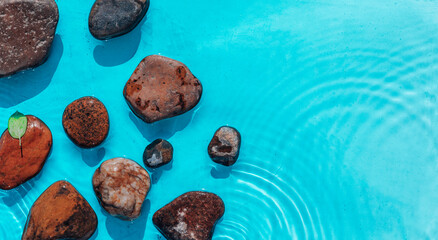 Sea stones in the sea water. Pebbles under water. Stones In Blue Water - Zen Concept