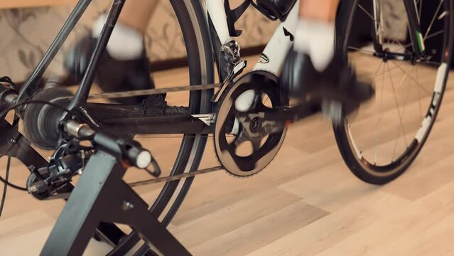 A person is pedaling on an indoor cycling trainer