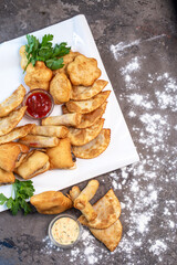 National Kazakh pastries baursaki in a plate on the table top view