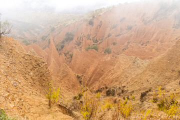 valley eroded, over the centuries, between the provinces of guadalara and madrid in spain, called las carcavas, covered by fog