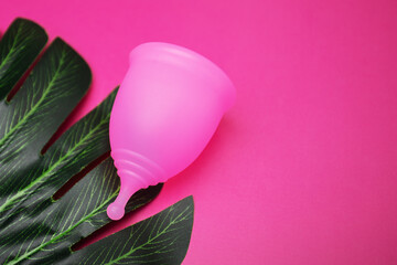 menstrual cup and green leaf eco friendly menstruation feminine hygiene product
