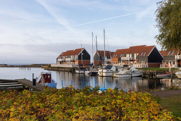 Marina Klintholm resort with sailing boats in fall, Møn, Sealand, Denmark