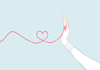 運命の赤い糸を結んでいる女性の手