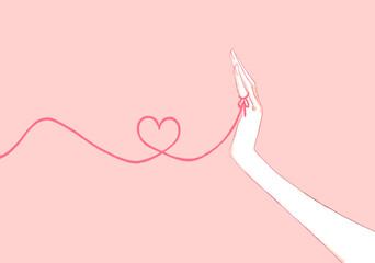 運命の赤い糸を結んでいる女性の手