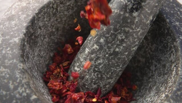 Chili pepper poured into a mortar