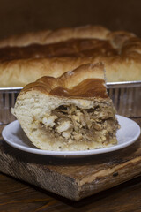 Piece of pie with cabbage and rice.