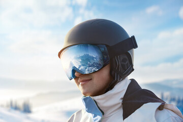 Close Up Of The Ski Goggles Of A Man With The Reflection Of Snowed Mountains. Snowboarder Man on...