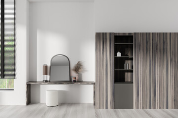 Elegant bedroom interior with dressing table and shelf with panoramic window