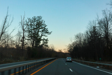 Fototapeta premium car driving on the road in autumn