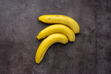 Ripe yellow bananas fruits, bunch of ripe bananas, isolated dark, clipping path. - Powered by Adobe