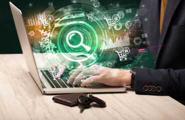 Business hand typing on a modern laptop