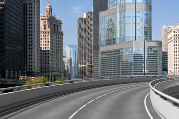 Obraz premium Empty urban asphalt road exterior with city buildings background. New modern highway concrete construction. Concept of way to success. Transportation logistic industry fast delivery. Chicago. USA.