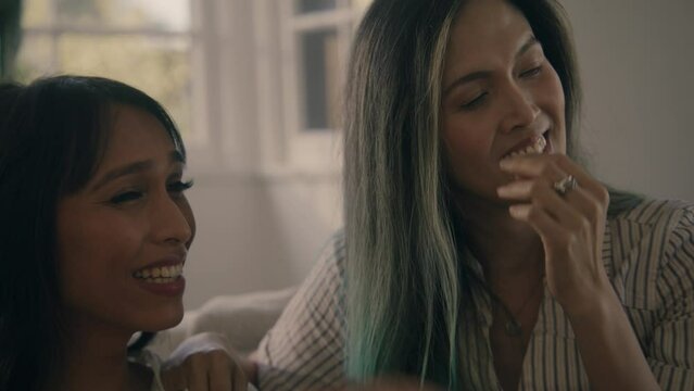 woman teases her friend about something and they laugh