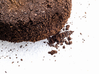 Ground coffee powder isolated on white background..Used coffee grounds after espresso machine and coffee beans on white  background.Caffeine addiction concept.