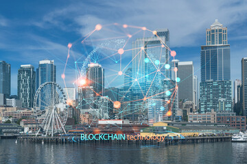 Fototapeta na wymiar Seattle skyline with waterfront view. Skyscrapers of financial downtown at day time, Washington, USA. Decentralized economy. Blockchain, cryptography and cryptocurrency concept, hologram