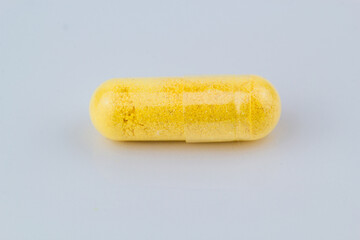 close up of herbal powder in capsule or vitamin b complex powder. 