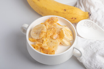 Cornflakes breakfast, banana, fresh milk, healthy food