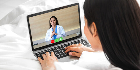 Fototapeta na wymiar Woman talk speak using laptop computer and video conference online with doctor and stethoscope service help support team discussing and consulting talk video chat call checkup information at home