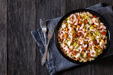 macaroni salad with shrimps, mussels, fish, leek