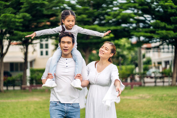 Portrait of enjoy happy love asian family father and mother holding cute little asian girl child...