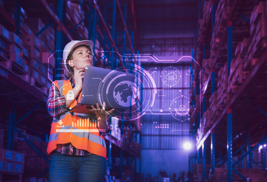 Warehouse staff working with hologram virtual interface searching panel of global logistics network distribution and transportation center - Powered by Adobe