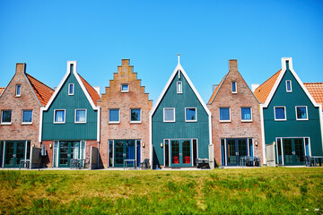 Fototapeta na wymiar Colorful houses in marine park in Volendam