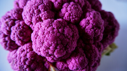Top view whole violet cauliflower, isolated, closeup and selective focus.