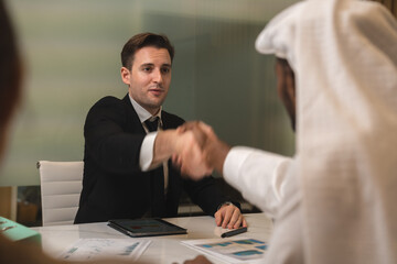 Emirate man person having business deal agreements with partnership team, Arabian manager making...